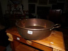 A large copper pan.