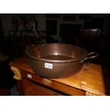 A large copper pan.