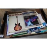 A box of 25 guitar music books including all relevant accompanying CD's.
