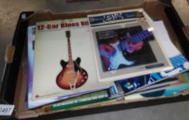 A box of 25 guitar music books including all relevant accompanying CD's.