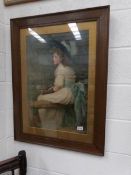 An oak framed and glazed print of a young girl.