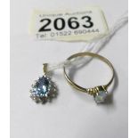 A gold oval sapphire pendant and a topaz solitaire ring, size T.