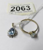A gold oval sapphire pendant and a topaz solitaire ring, size T.