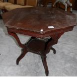 An octagonal occasional table with galleried under shelf.
