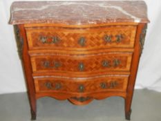 A French serpentine front parquetry chest with marble top.