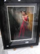 A framed and glazed limited edition print (9/280) of a lady, signed M J Neale.