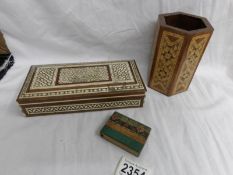 A inlaid pen holder, an inlaid box and a wooden match holder.