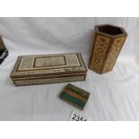 A inlaid pen holder, an inlaid box and a wooden match holder.