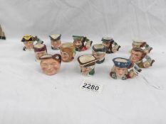 12 miniature Royal Doulton character jugs.