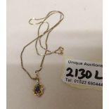 A 9ct gold pendant on 9ct gold chain set diamonds and sapphire, gross weight 4 grams.