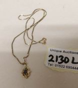 A 9ct gold pendant on 9ct gold chain set diamonds and sapphire, gross weight 4 grams.