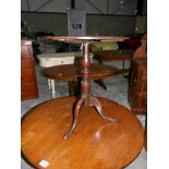 A small oak tripod table.