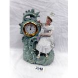 A bisque porcelain mantel clock.