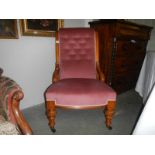 A Victorian mahogany nursing chair.