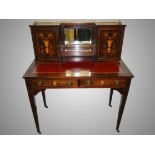A 19th century ladies writing desk with brass gallery.