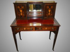 A 19th century ladies writing desk with brass gallery.