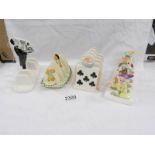 A Clover 7 dwarfs toast rack, a Carlton ware toast rack and 2 others.