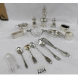 A mixed lot of hall marked silver items including salts, pepper pots, sugar sifter,