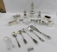 A mixed lot of hall marked silver items including salts, pepper pots, sugar sifter,