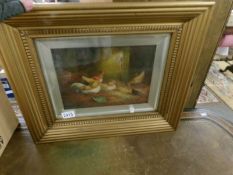 A gilt framed and glazed oil on canvas study of chickens in a bard signed J Jackson.