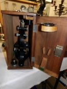 A cased microscope by Beck's of London, case marked 1945.