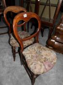 A pair of Victorian mahogany dining chairs.