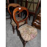 A pair of Victorian mahogany dining chairs.