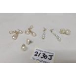 3 pairs of pearl earring and 2 odd pearl earrings.