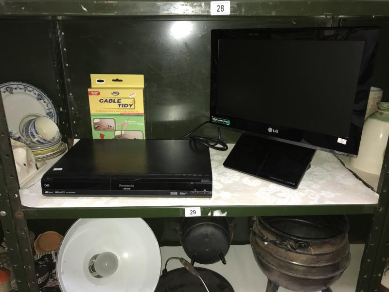 An L.G. DVD built in TV and a Panasonic DVD player (missing cable and no remotes).