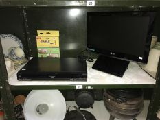 An L.G. DVD built in TV and a Panasonic DVD player (missing cable and no remotes).