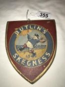 An old wood painted Butlins, Skegness Shield, painted 1946.