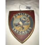 An old wood painted Butlins, Skegness Shield, painted 1946.