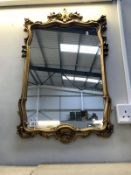 An ormolu gilt framed mirror.