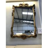 An ormolu gilt framed mirror.