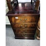 A wood effect 2 drawer filing cabinet with leather inset top.