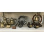 A shelf of brass & pewter including tea set & bell gong etc.