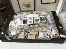 A large assortment of cigarette cards.