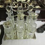 A 6 bottle cruet set on silver plated stand.