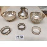 A silver jug, 2 silver bowls and 3 silver napkin rings.