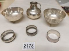 A silver jug, 2 silver bowls and 3 silver napkin rings.