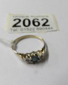 A gold topaz and diamond ring, size S.