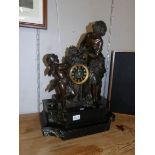 A large French bronze and marble mantel clock.