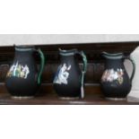 A set of 3 graduated jugs decorated with Roman scenes.