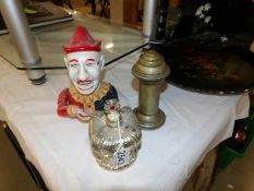 A clown mechanical money box, a crown money box and an unusual brass box.