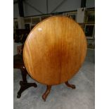 A Victorian mahogany circular tip top table.