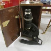 A small cased microscope.