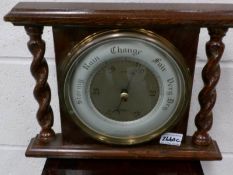 An oak aneroid barometer,.
