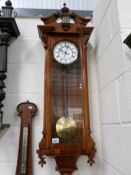 A Victorian mahogany wall clock.