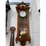 A Victorian mahogany wall clock.