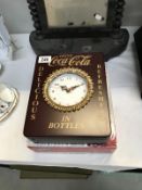 A 'Coca-Cola' keyholder clock box.